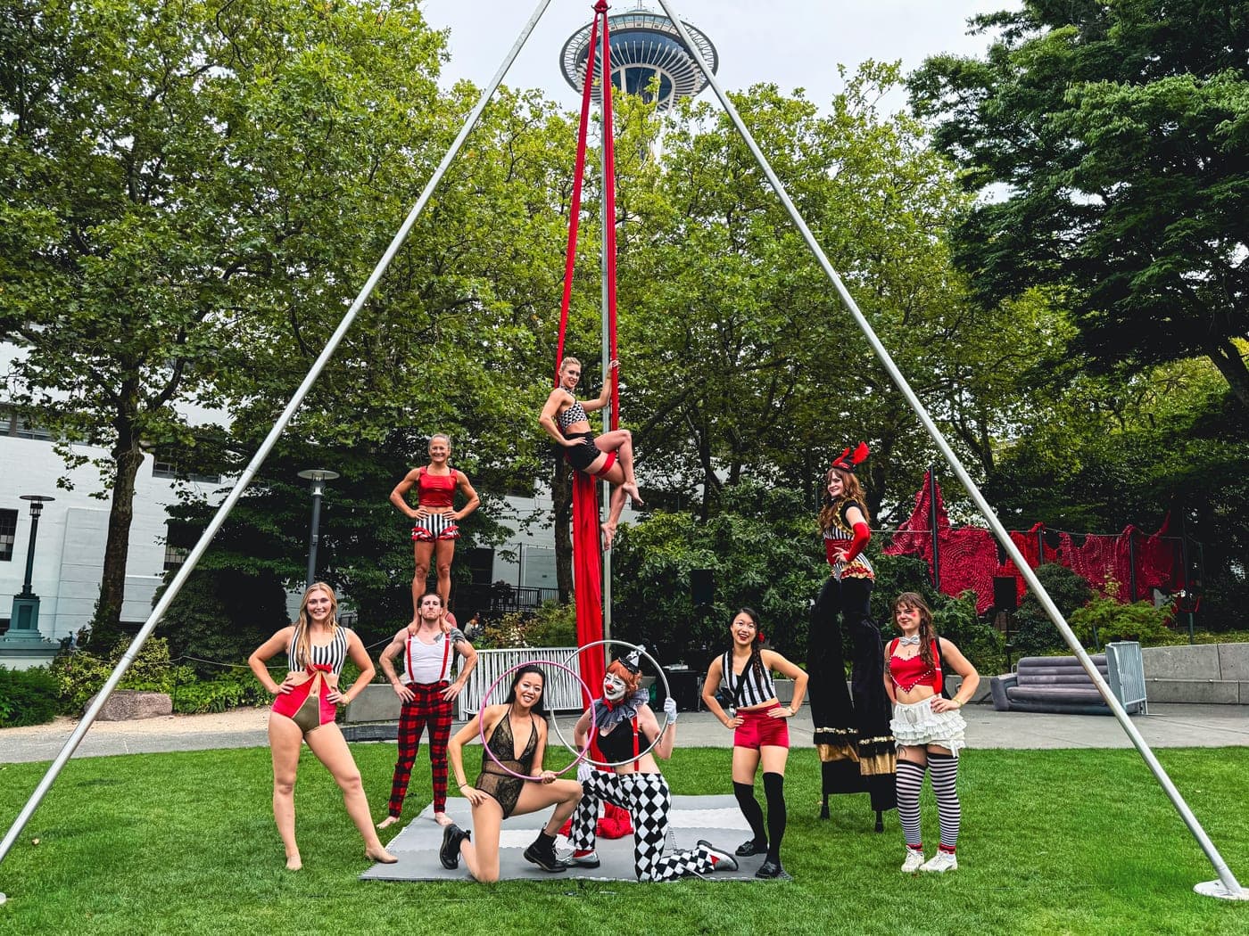 The Levity troupe with an aerial rig on the lawn at Seattle Center