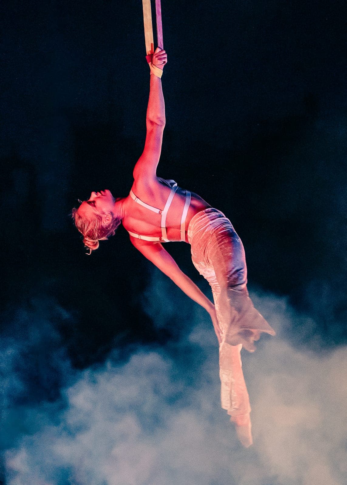 A Levity aerialist suspended mid-performance