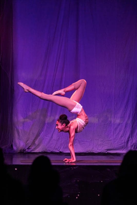 A contortionist holding a pose