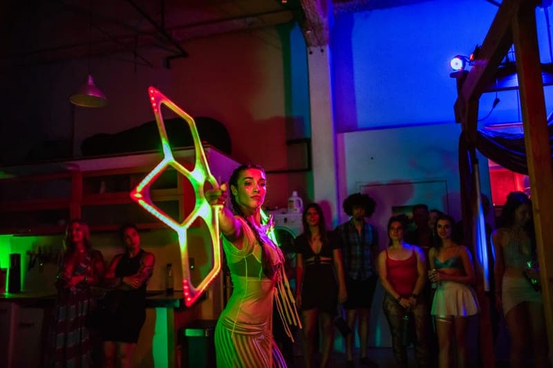 A performer spinning LED fans