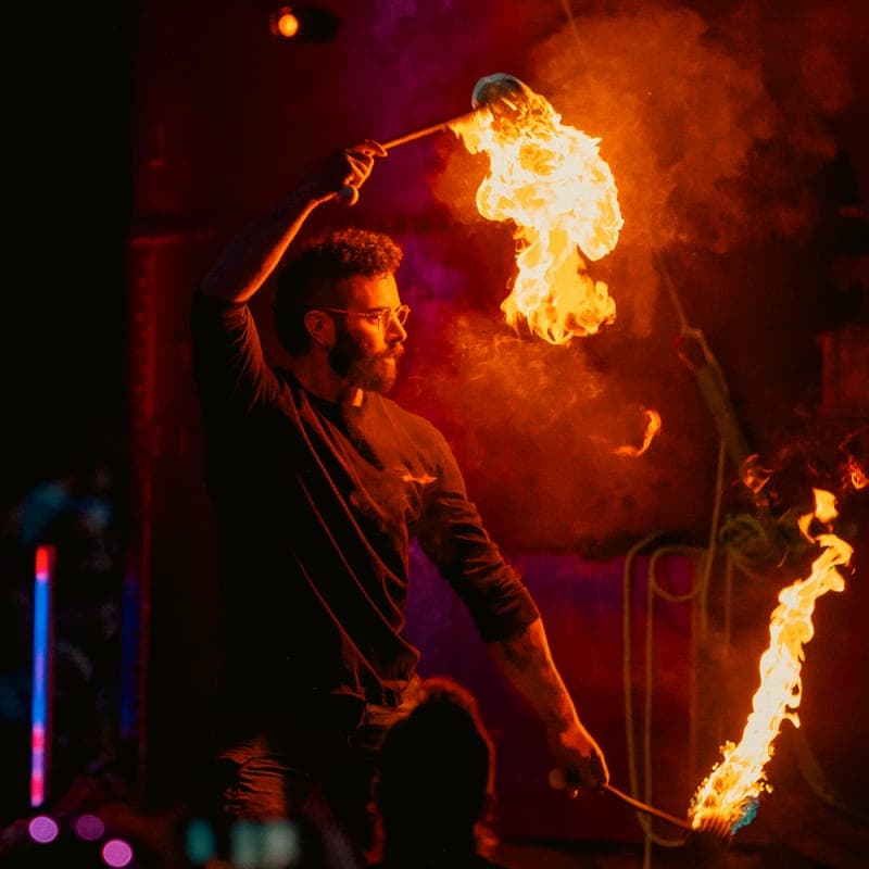 A performer spinning poi