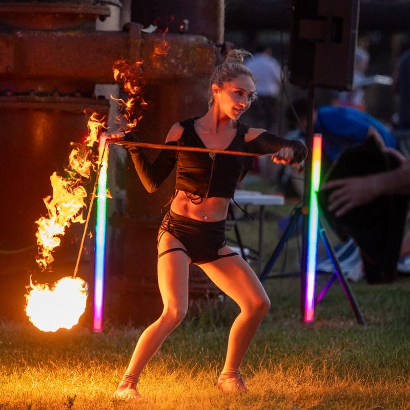 A performer with a rope dart