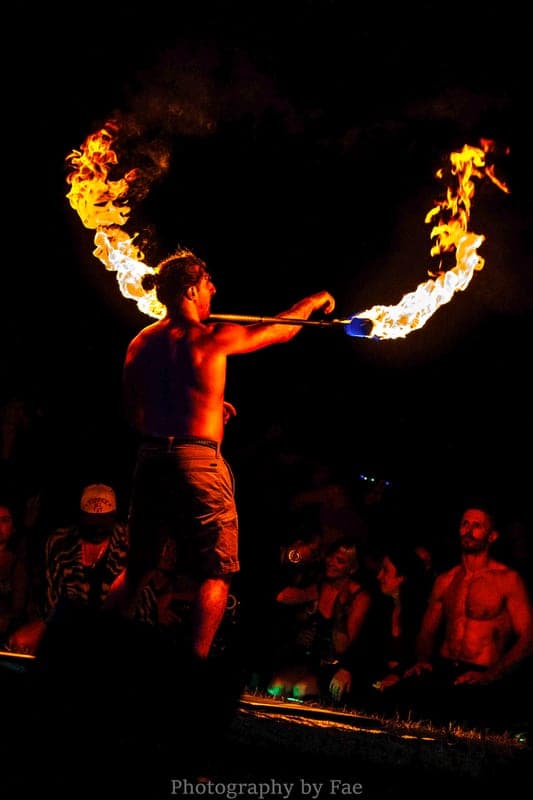 A performer spinning staff