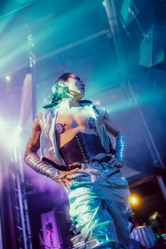 A boylesque performer mid-number